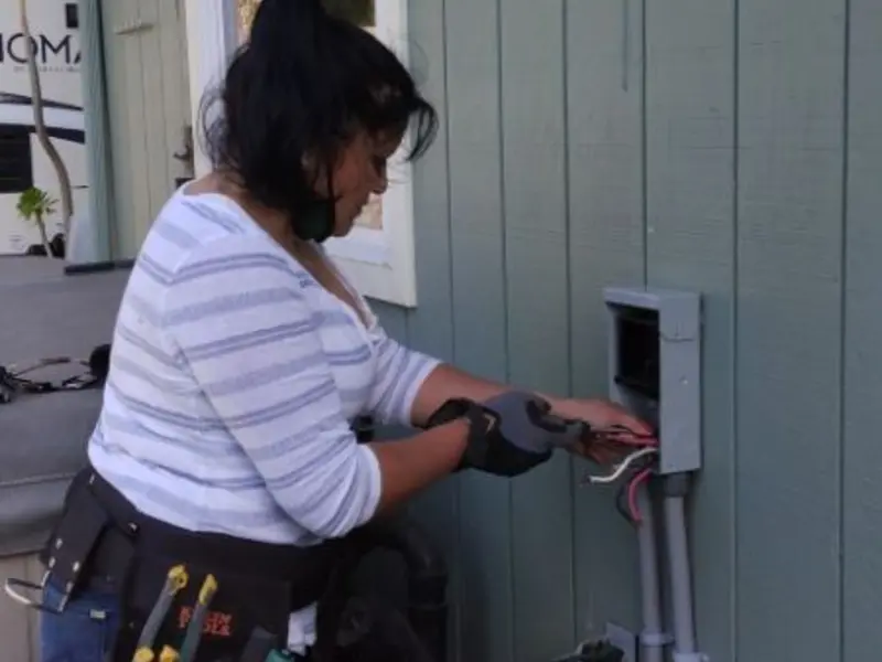 Licensed electrician wiring an exterior subpanel in Galena